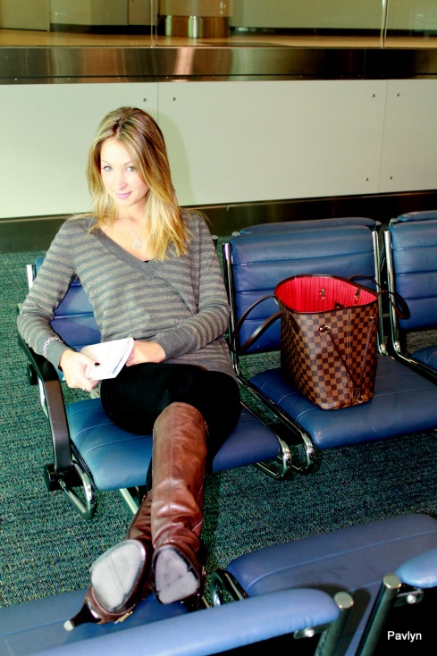 Waiting for our flight - so comfy in a striped sweater and tights!