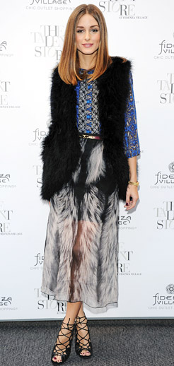 Olivia Palermo wearing maxi skirt with black fur vest